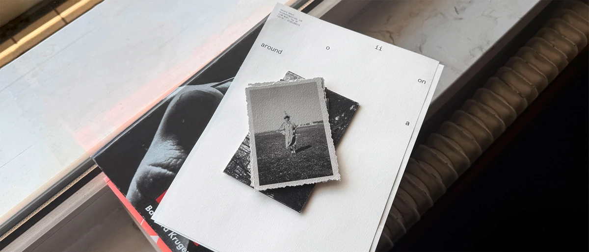 Black-and-white family photograph placed on Hoiia printed matter.